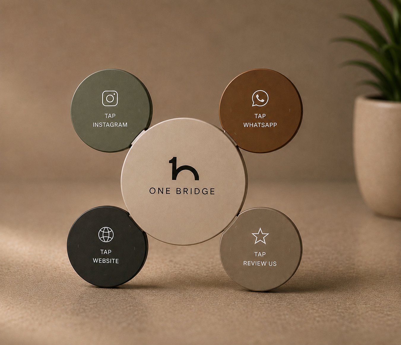 Five OneBridge NFC discs arranged around a central OneBridge tap